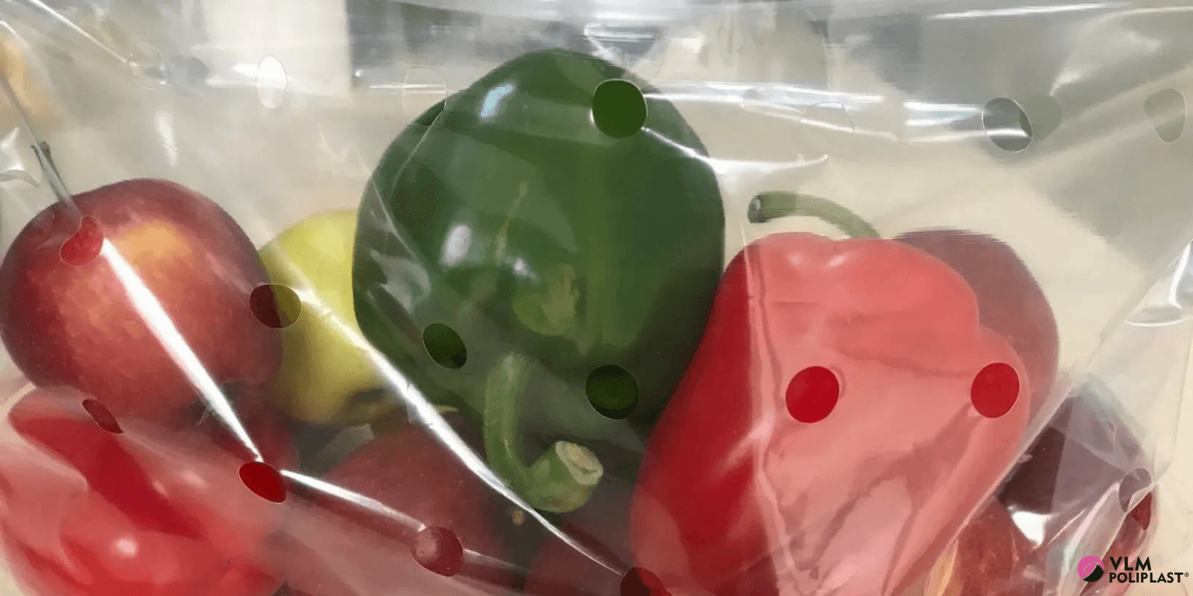 Perforated film for fresh produce: peppers packed on an automated line with ventilation holes